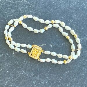 14kt yellow gold two strand freshwater pearls with gold beads, bars and clasp 7”
